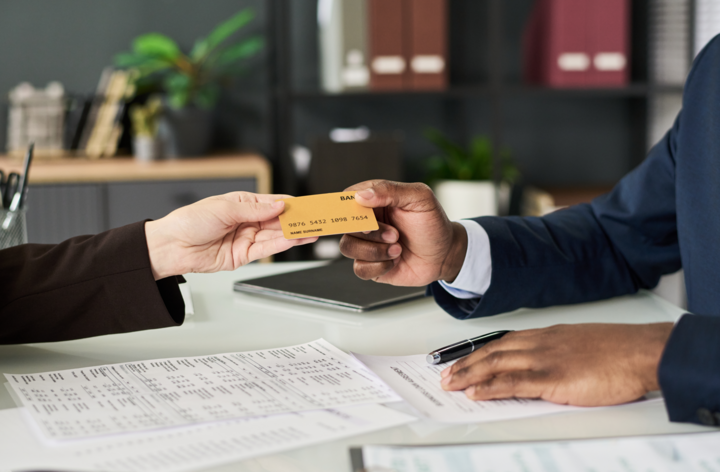 Businesswoman Getting Credit Card At Meeting, business credit with bad credit